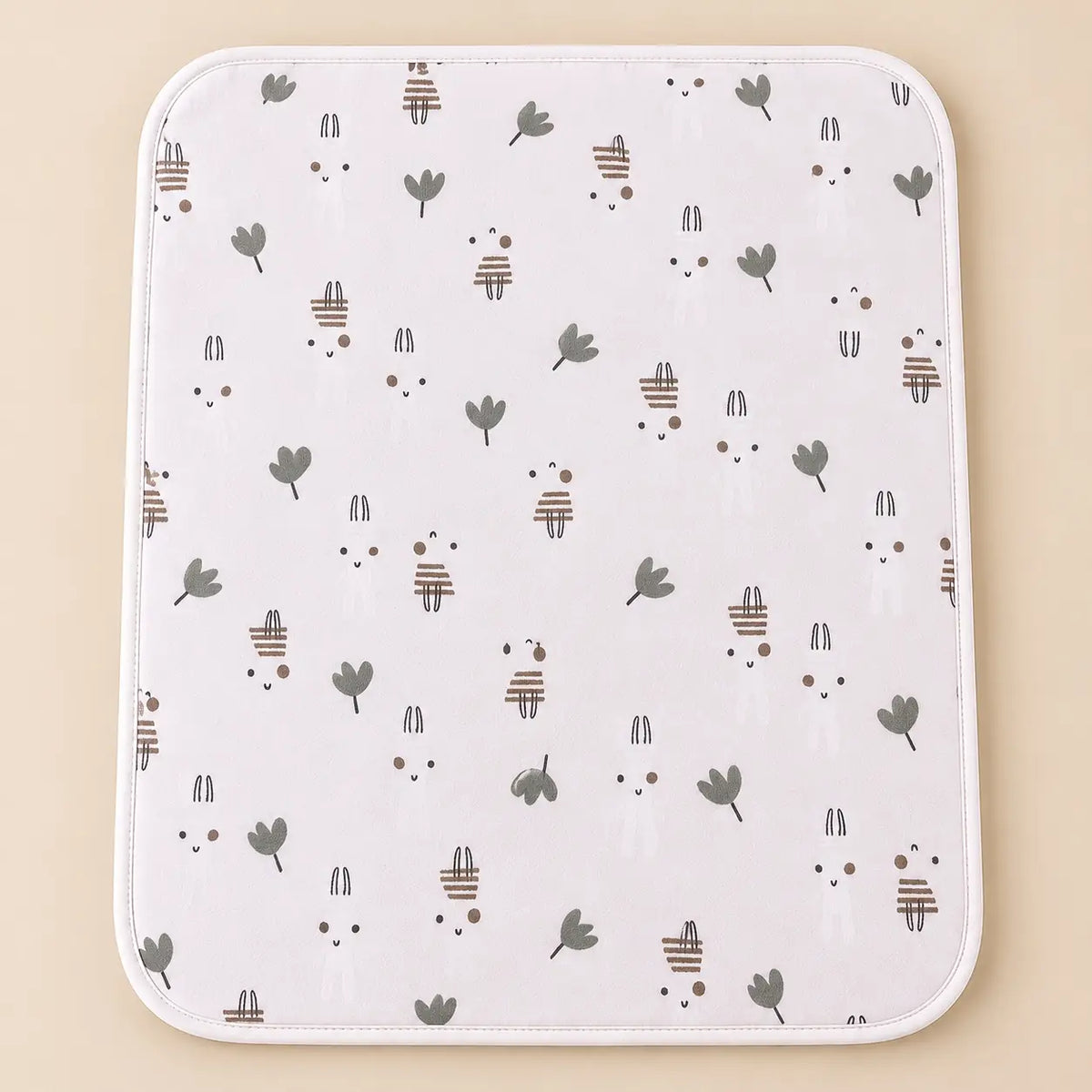 White cotton baby changing sheet with cute bunny and green leaf print
