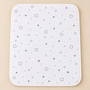 White waterproof baby changing sheet with grey stars and circles, 17x22 inch