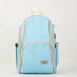 Sky blue baby diaper backpack with beige zippers and multiple storage compartments, front view