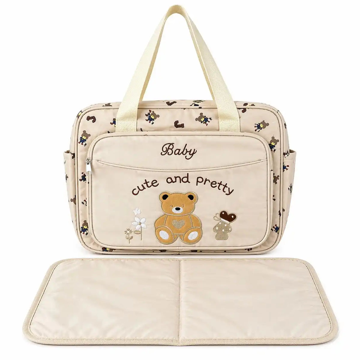 Beige teddy baby diaper bag with foldable changing mat and carry handles