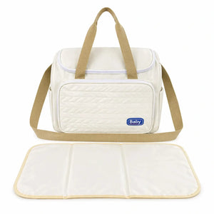 Beige water-resistant baby diaper bag with carry handles and changing mat