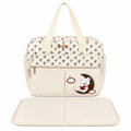 Cream baby print diaper bag with matching foldable changing sheet