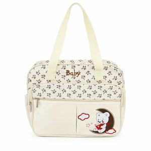 Cream baby print diaper bag front view with spacious storage compartment