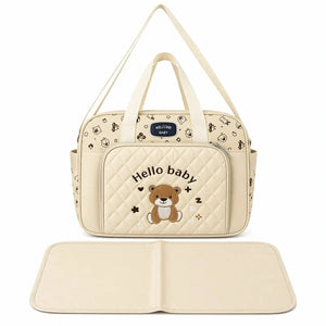 Beige waterproof baby diaper bag with multiple pockets and foldable changing mat