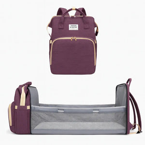 Purple baby diaper backpack with foldable baby bed and mesh side panels