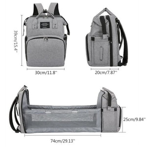 Grey baby diaper backpack with foldable baby bed size guide showing bag and bed dimensions