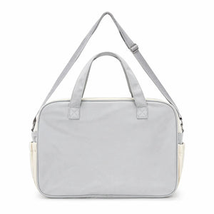 Grey baby diaper bag back view with strong carry handles and shoulder strap