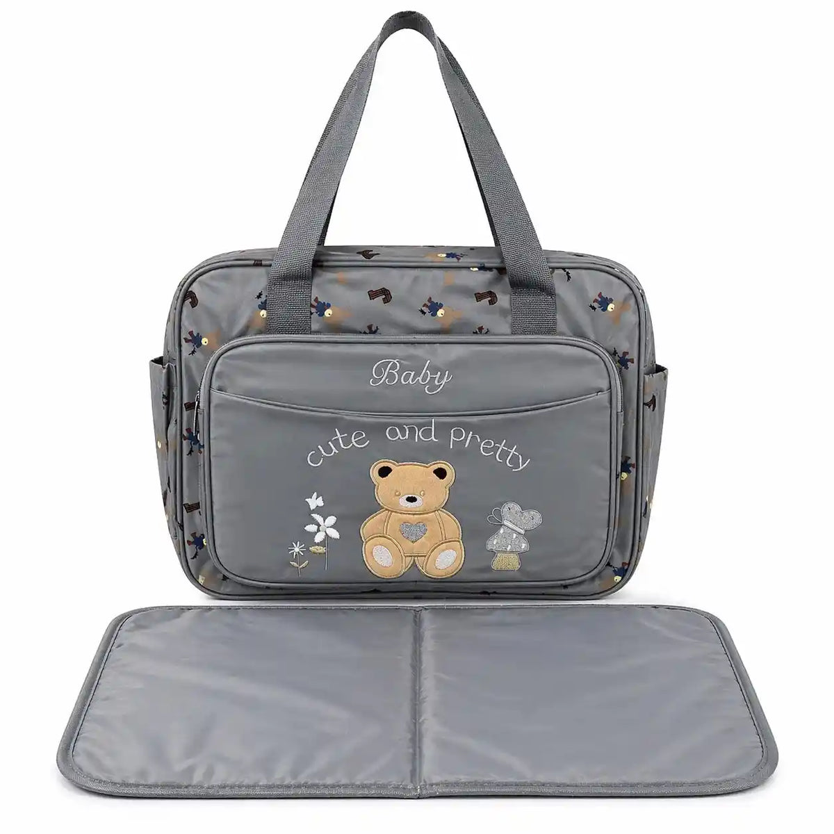 Grey teddy baby diaper bag with multiple storage compartments and changing mat