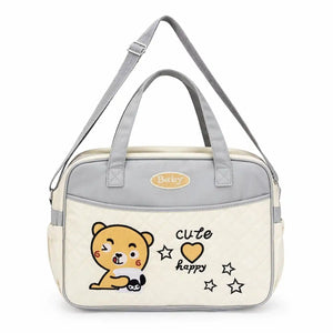Cream baby diaper bag with bear design, spacious storage and shoulder strap
