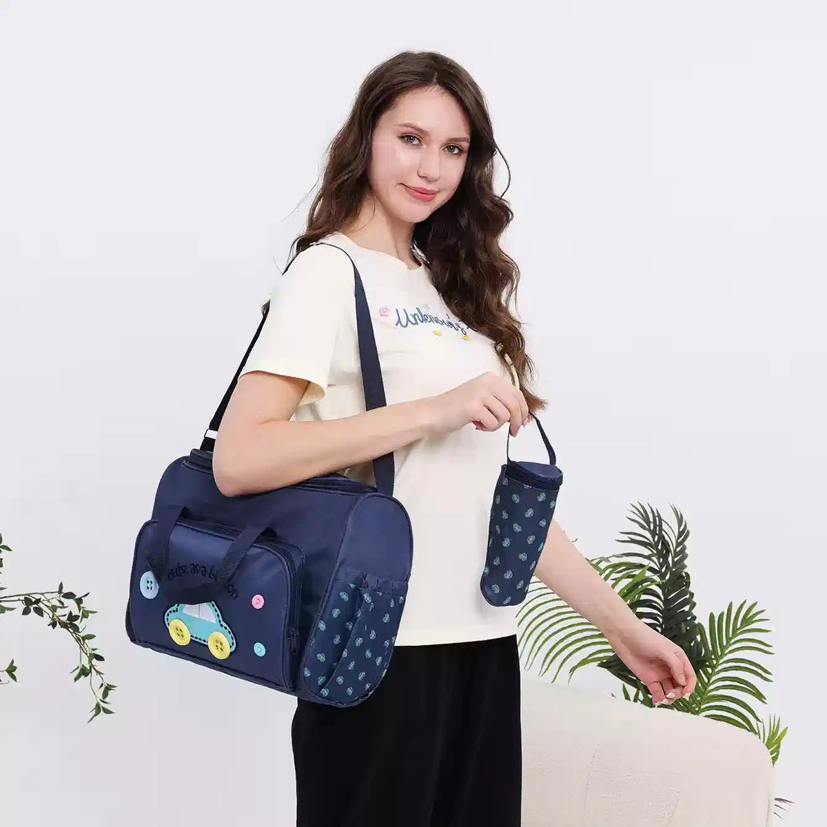 Parent carrying dark blue baby travel organizer large bag for outings