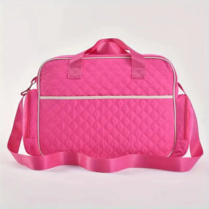 Pink baby diaper bag back view with quilted texture and strong carry handles