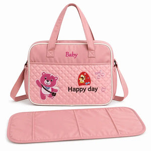 Pink baby diaper bag with cute baby design and matching changing mat