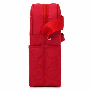 Folded red baby diaper bag with bow design