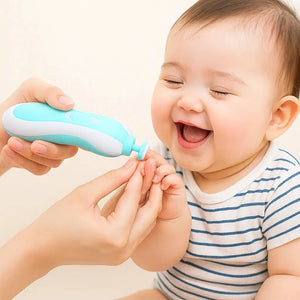 Blue baby electric nail trimmer gently filing infant fingernails