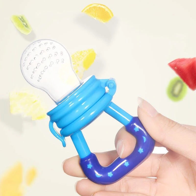 Blue baby fruit feeder pacifier held in hand