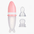 Pink 2-in-1 silicone spoon feeder and fruit pacifier with protective cap for baby feeding