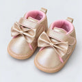 Champagne Gold Baby Girls Bow Prewalker Shoes with Pink Lining and Metallic Finish Angle View