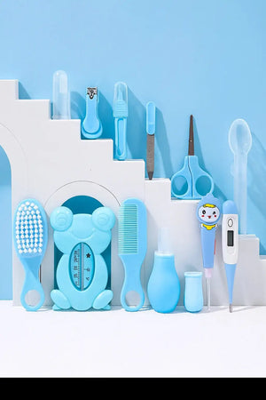 Blue baby grooming care kit accessories including brush, comb, thermometer, nail clipper, scissors and medicine tools