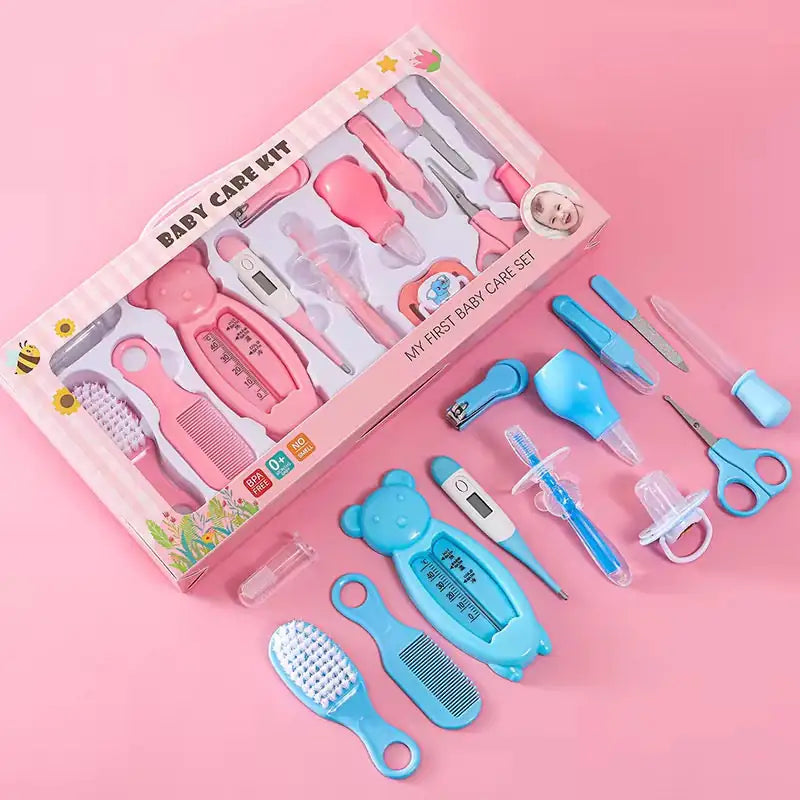 Baby grooming care kit in pink packaging with blue grooming and hygiene accessories