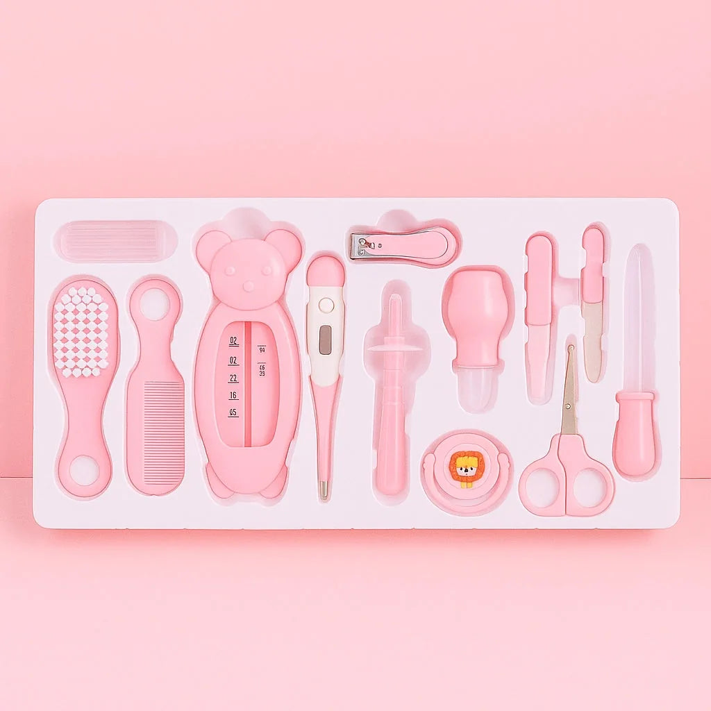Pink baby grooming and care kit with thermometer, brush, comb, nail clipper, scissors and hygiene accessories