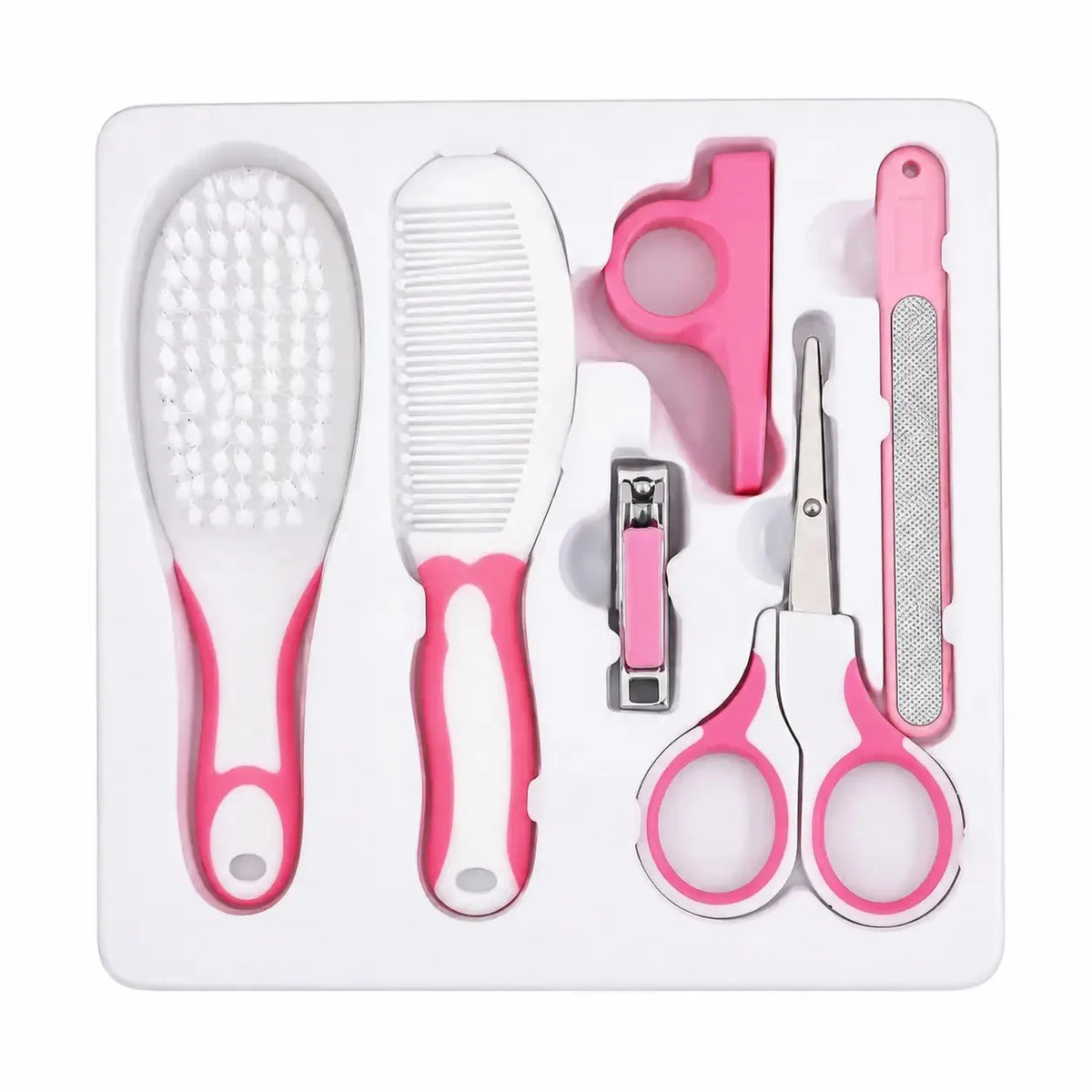 Pink baby grooming care kit arranged in tray with brush, comb, nail clipper, scissors and nail file