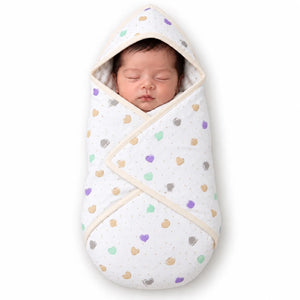 Cream baby hooded wrapping sheet with pastel heart print and overlapping wrap panels