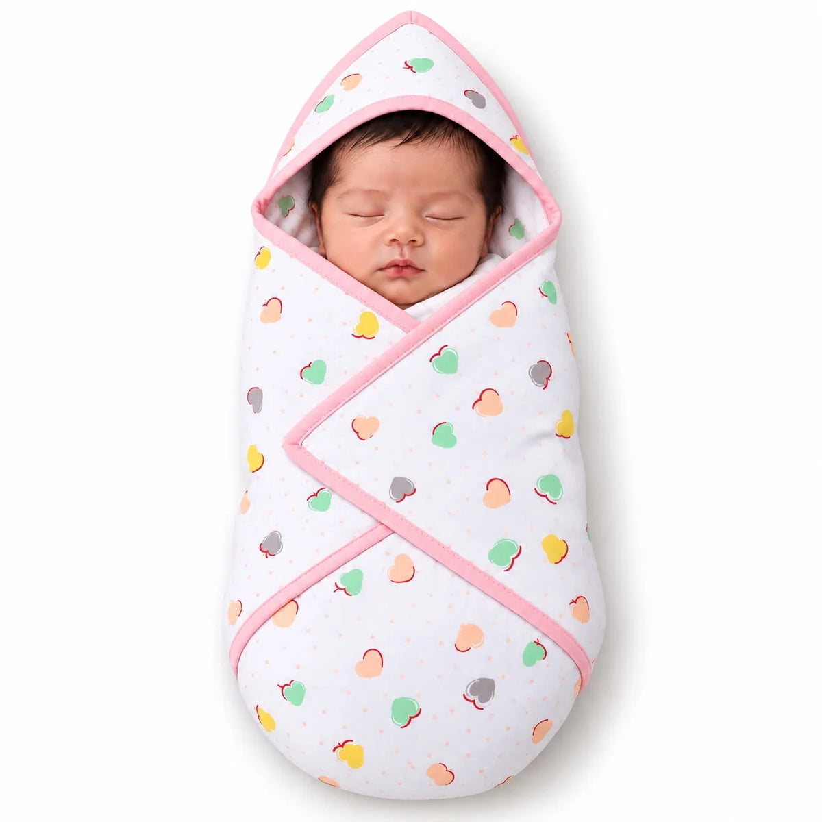 Newborn baby wrapped in pink baby hooded wrapping sheet with colorful heart pattern