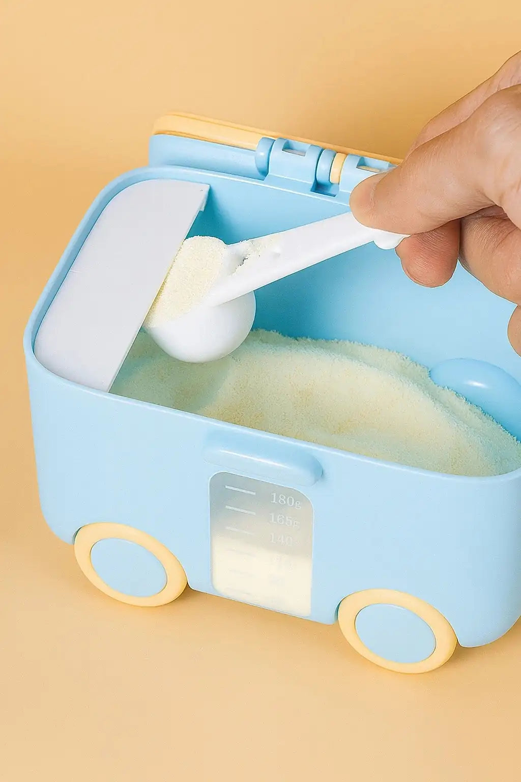 Blue baby milk powder container with scoop and measuring scale 