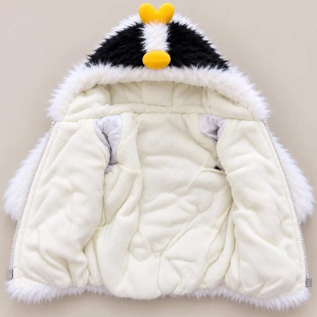 Kids white penguin hooded winter fur jacket opened to show cream fleece-style inner lining, long sleeves and zipper closure