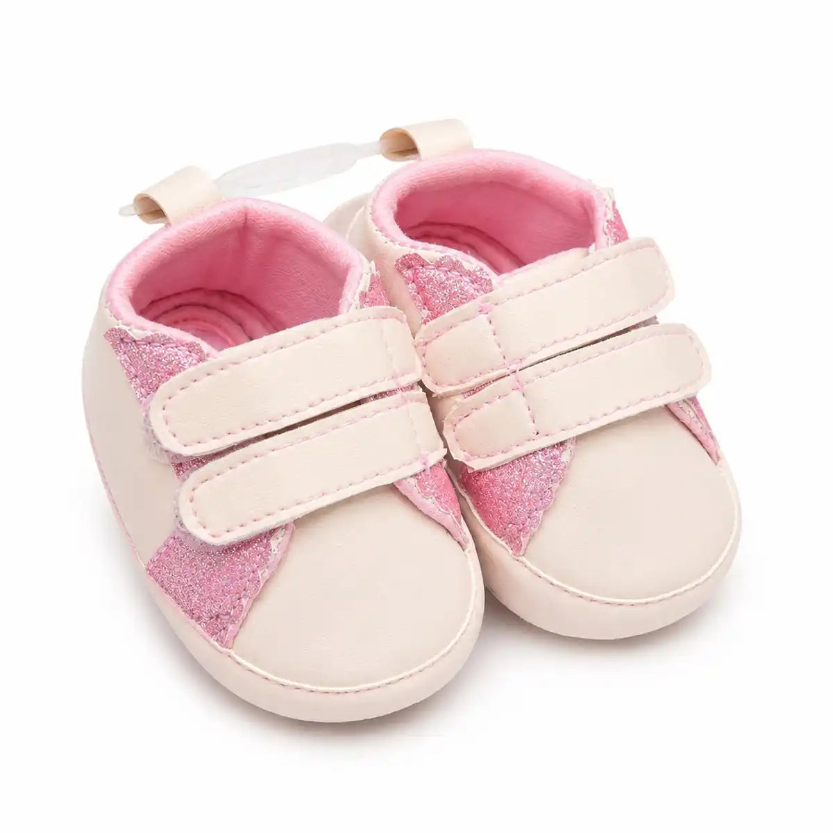 Baby pink glitter wing soft sole first walker shoes with double hook and loop straps – angled view