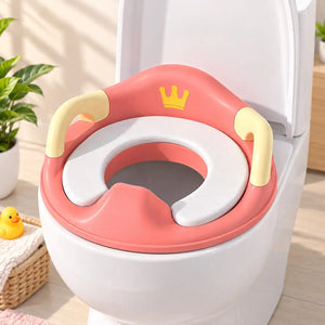 Pink baby potty training seat fitted on standard toilet