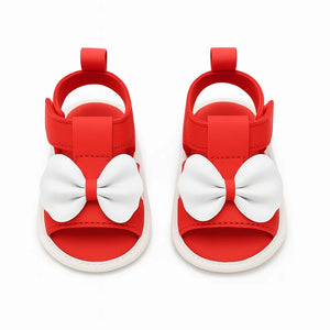 Red baby girl soft sole sandals with white bow accents and Velcro straps