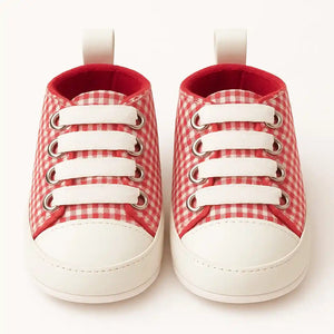 Front view of red and white baby prewalker sneakers