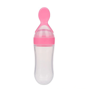Pink baby silicone spoon feeder bottle for baby food