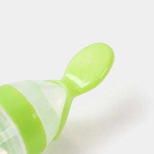 Close-up of soft silicone spoon tip on baby feeder bottle