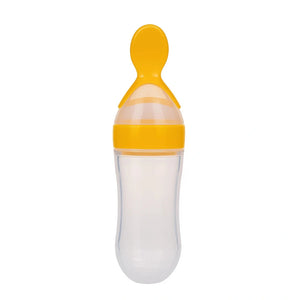 Yellow baby silicone spoon feeder bottle with soft spoon tip