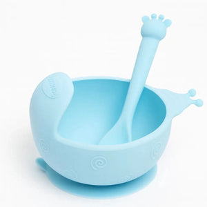 Blue silicone baby feeding bowl with suction base and soft spoon for self-feeding