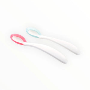 Pink and blue baby feeding spoons shown in side view