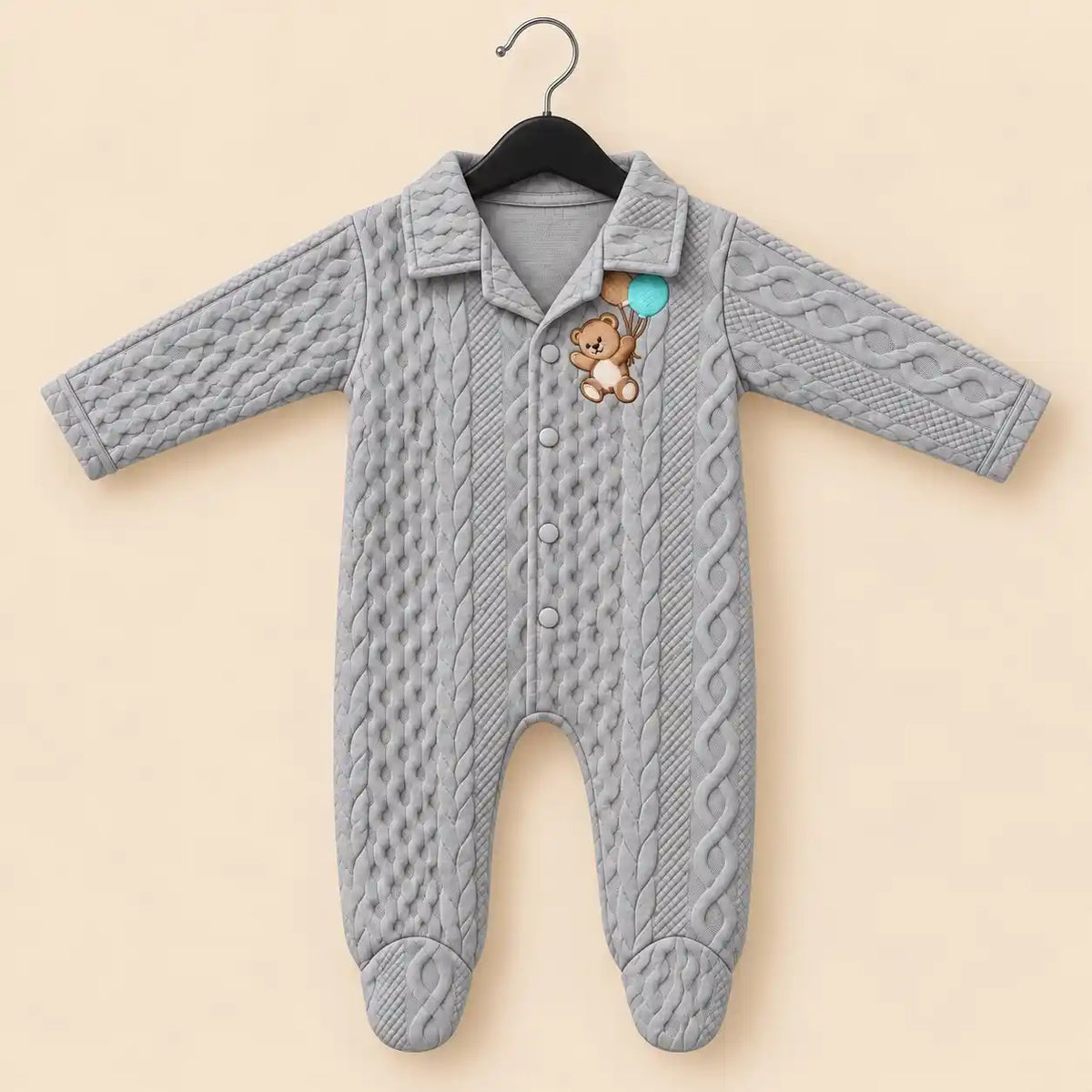 Light grey baby winter quilted footed romper with cable-knit-inspired texture, teddy bear embroidery and front snap buttons