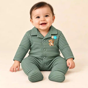 Baby wearing sage green winter ribbed quilted footed romper with teddy bear embroidery in seated pose