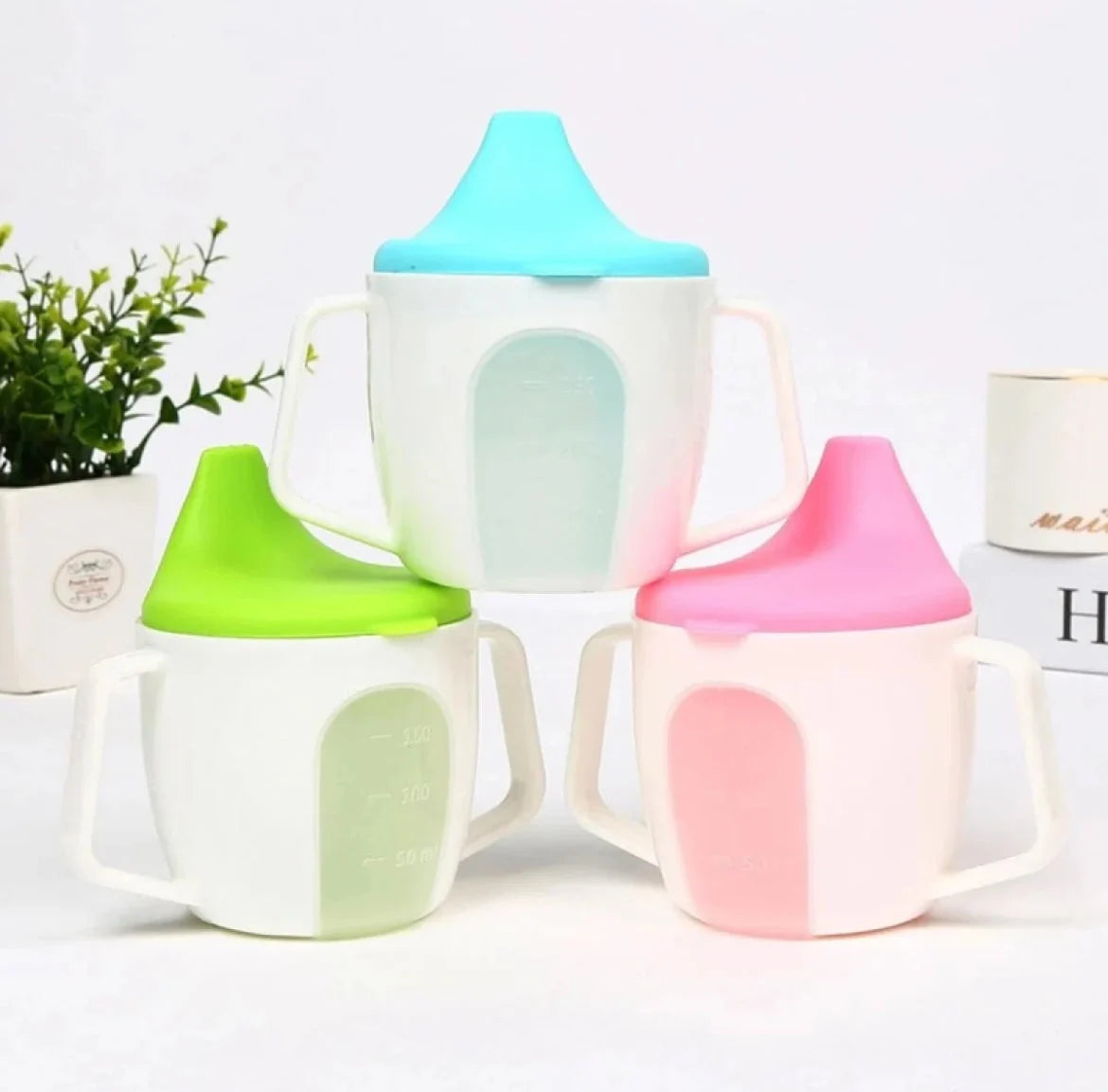 Baby training sippy cups with handles in blue green and pink colors