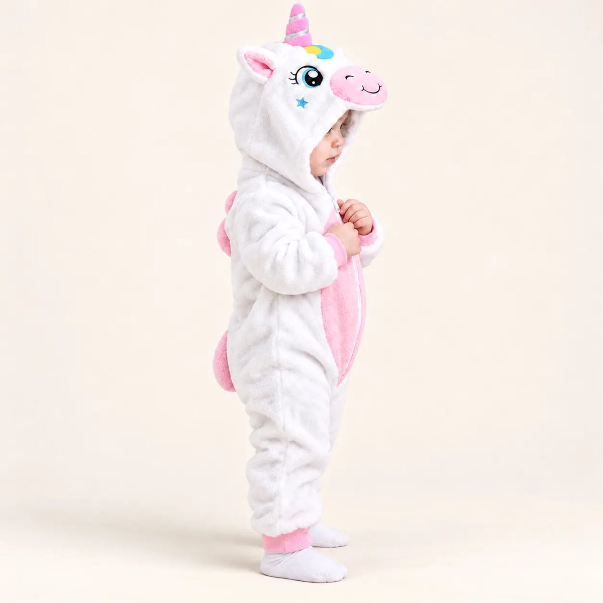 Side view of white and pink Unicorn Hooded Winter Romper featuring 3D unicorn face, pink belly panel and decorative plush back mane