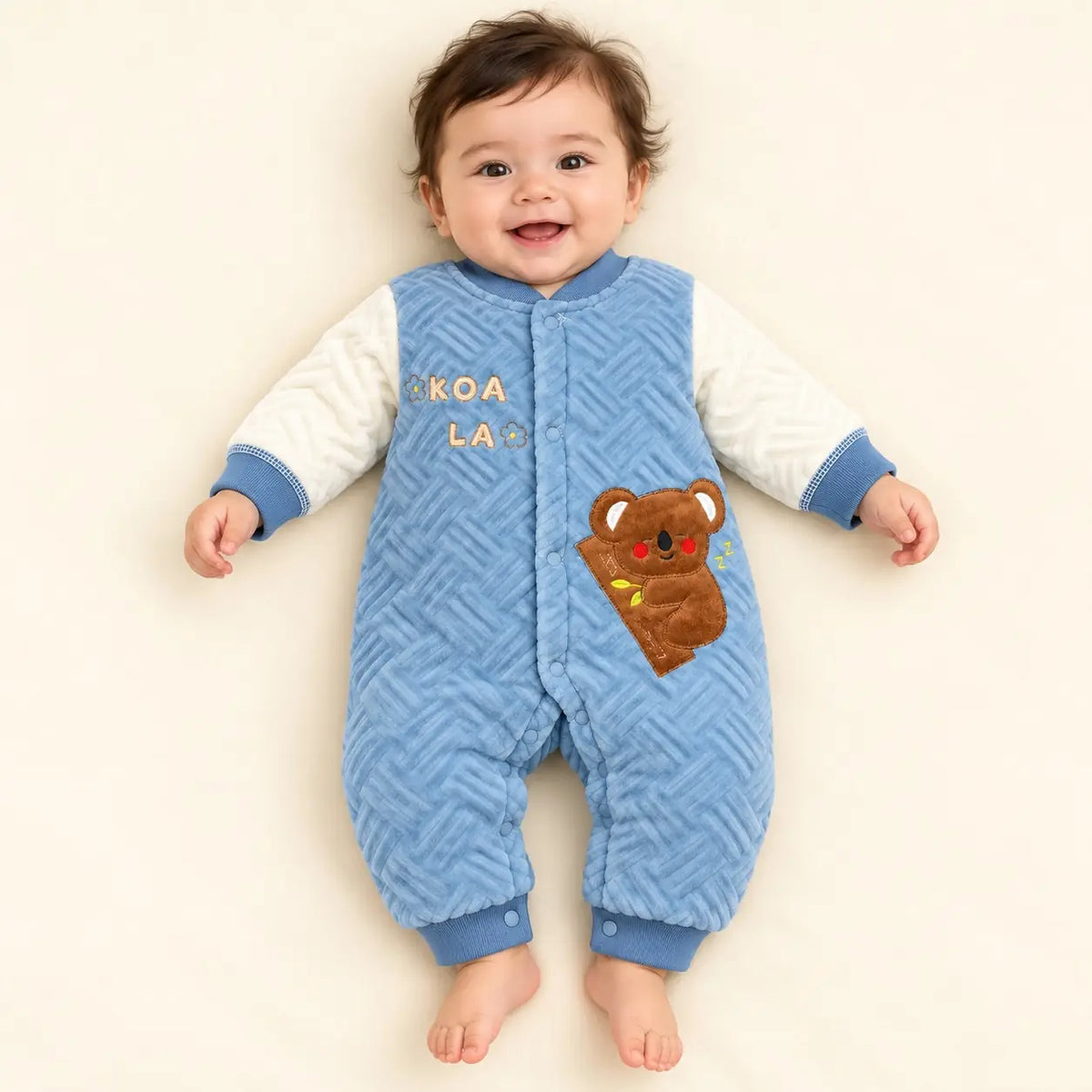 Baby Wearing Blue Quilted Winter Romper with Koala Design