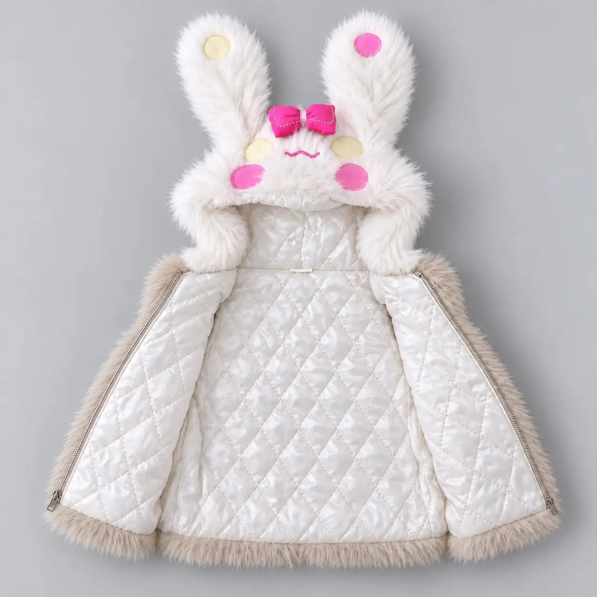 Girls beige bunny hooded fur vest opened to show white diamond-quilted inner lining, bunny ears and zipper closure