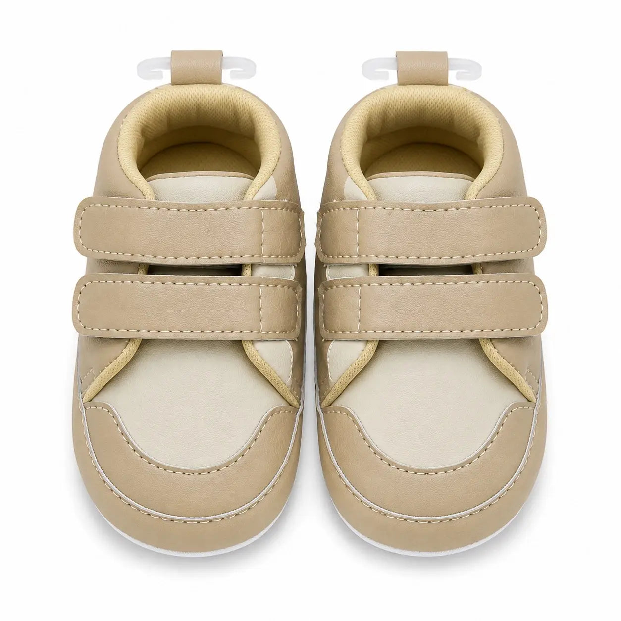 Front view of baby boys beige and cream soft sole double strap shoes