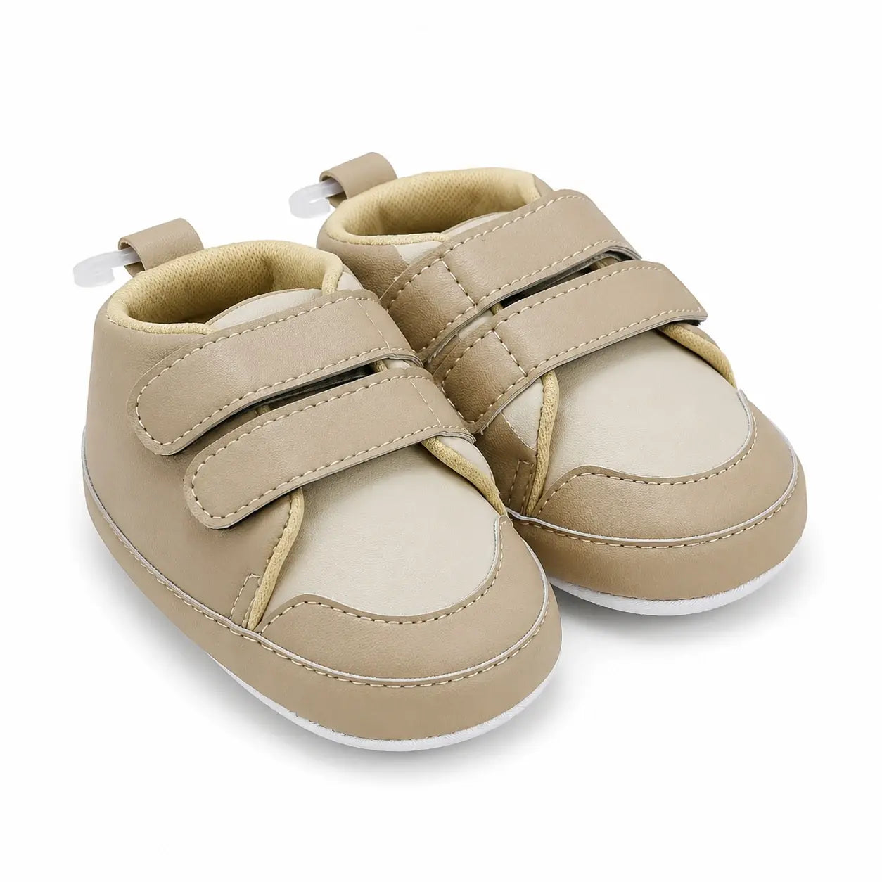 Side-angle view of beige soft sole prewalker shoes with adjustable straps