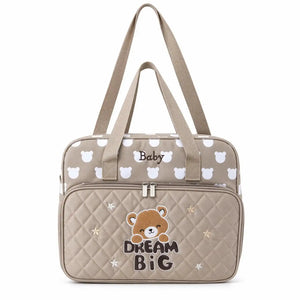 Beige teddy baby diaper bag with carry handles and adjustable shoulder strap
