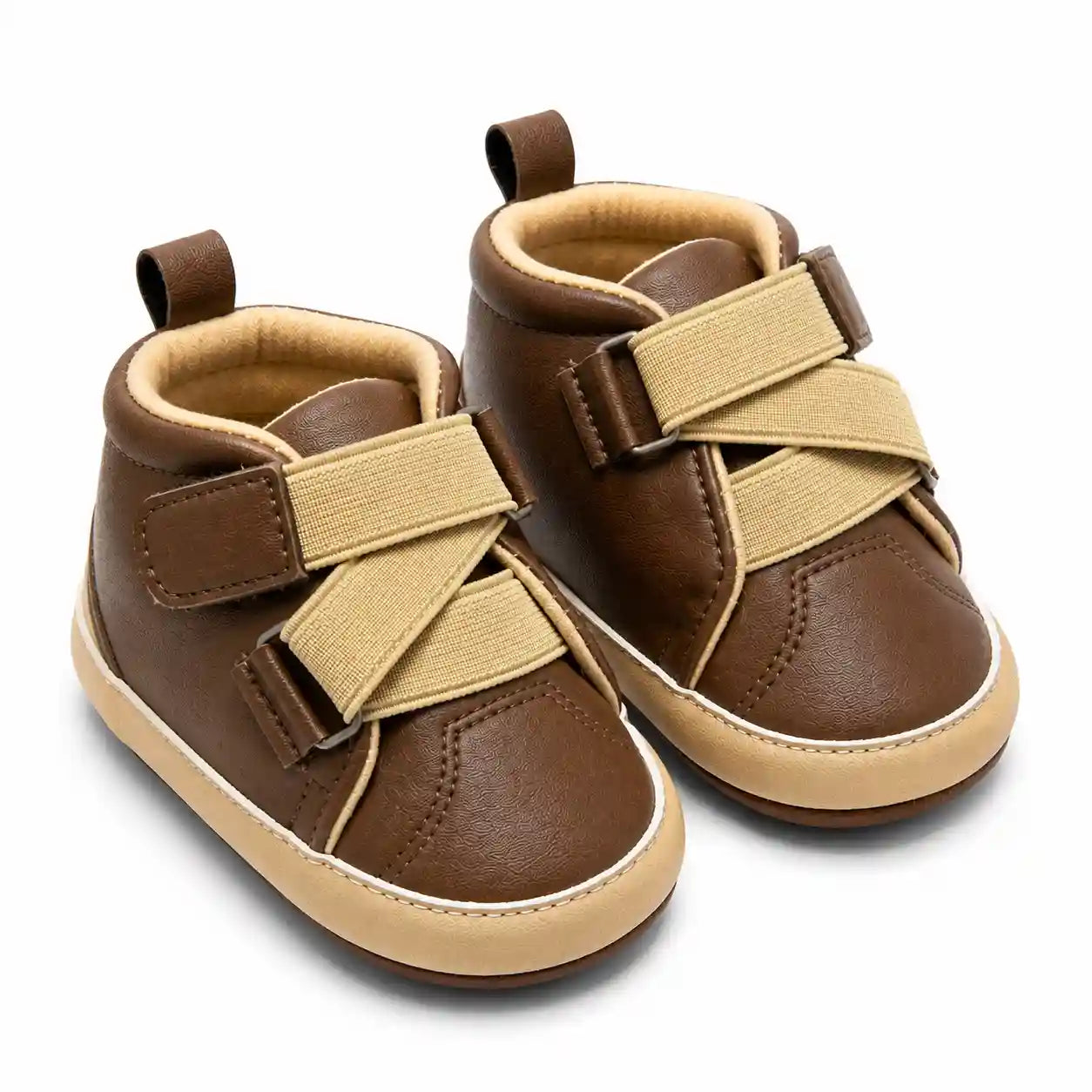 Brown cross strap casual baby shoes with beige detailing angled view