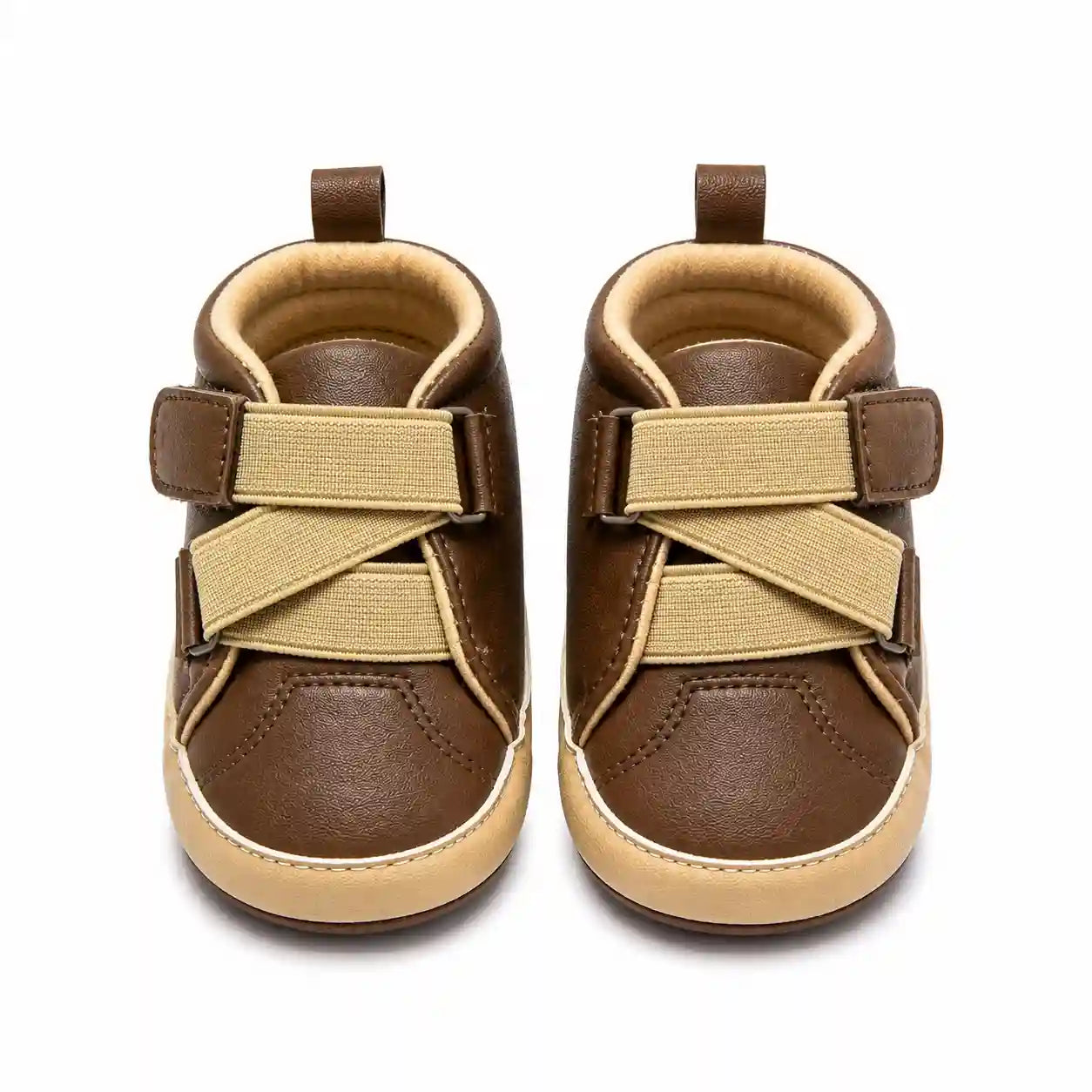 Brown baby shoes with beige cross strap design and contrast sole front view