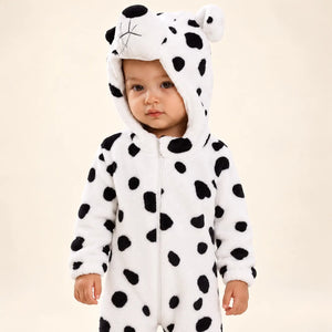 Child wearing Puppy Soft Fleece Costume Jumpsuit with black spotted pattern, attached animal hood and elasticated cuffs